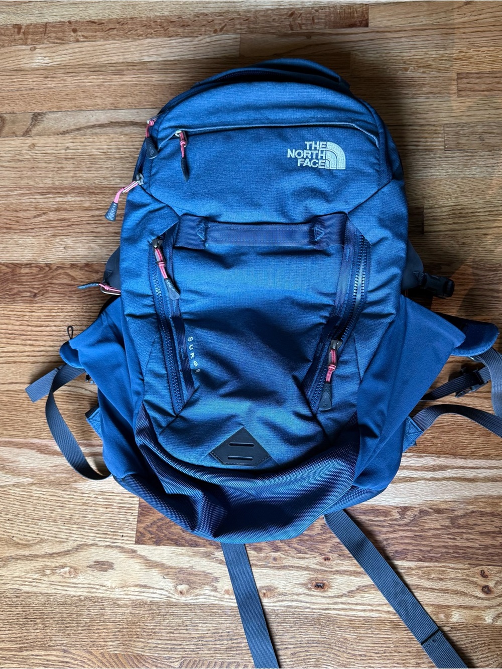The North Face Surge Blue Backpack with Coral Accents